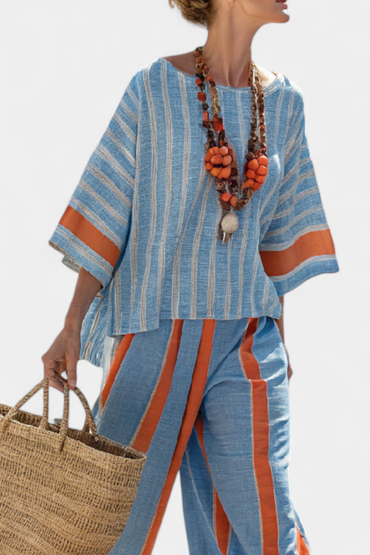 Blue striped tunic top with orange neckline trim and matching linen trousers