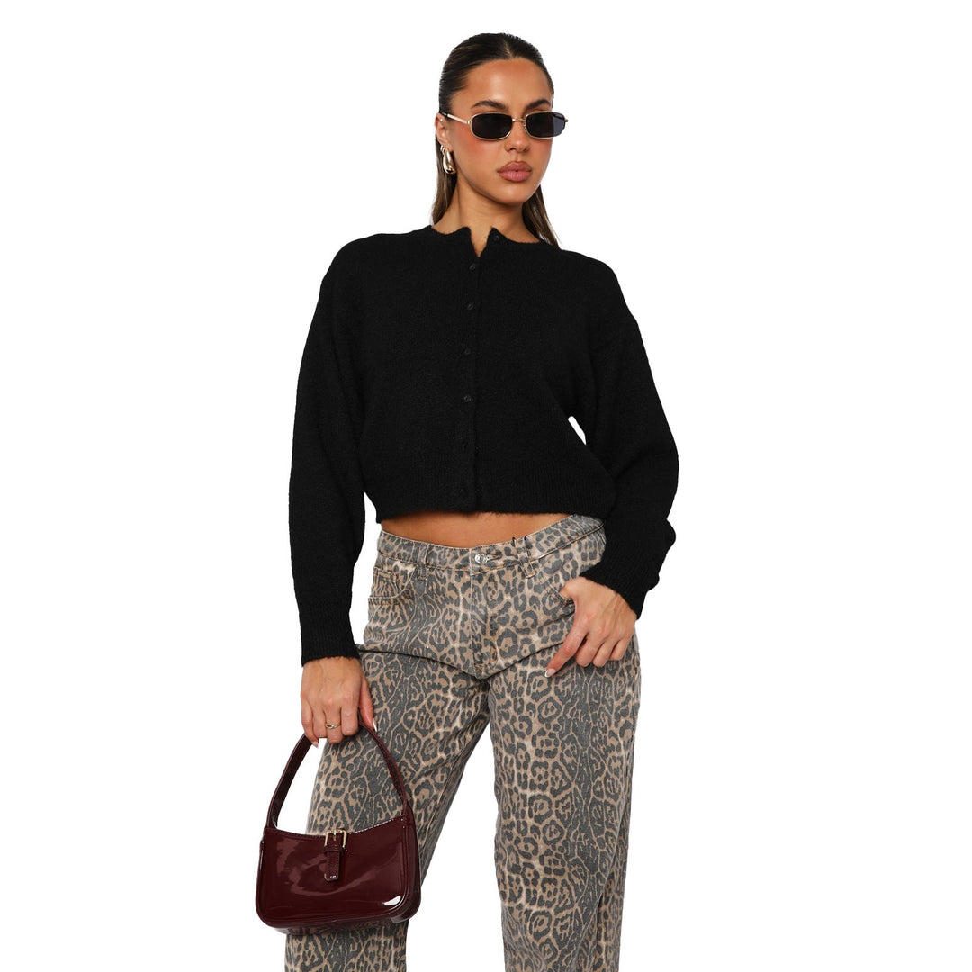Black cropped cardigan with long sleeves and front button placket