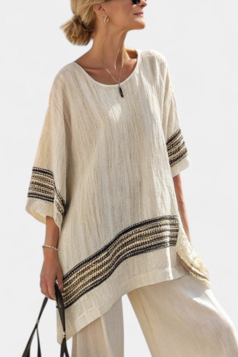 Cream linen tunic top with V-neck and dark striped border hem, loose sleeves