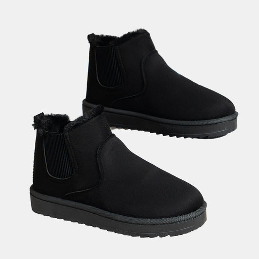Black cozy ankle boots with faux fur trim and elastic side gusset, grippy sole
