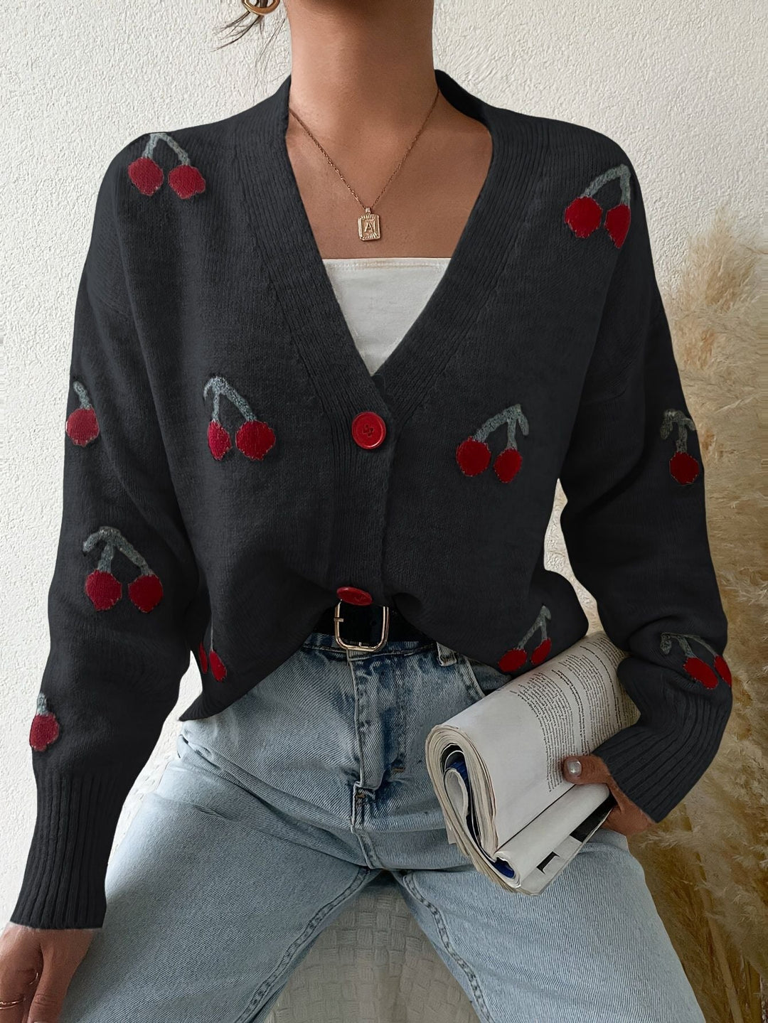 Black button-front long-sleeve cardigan with red cherry print and V-neck