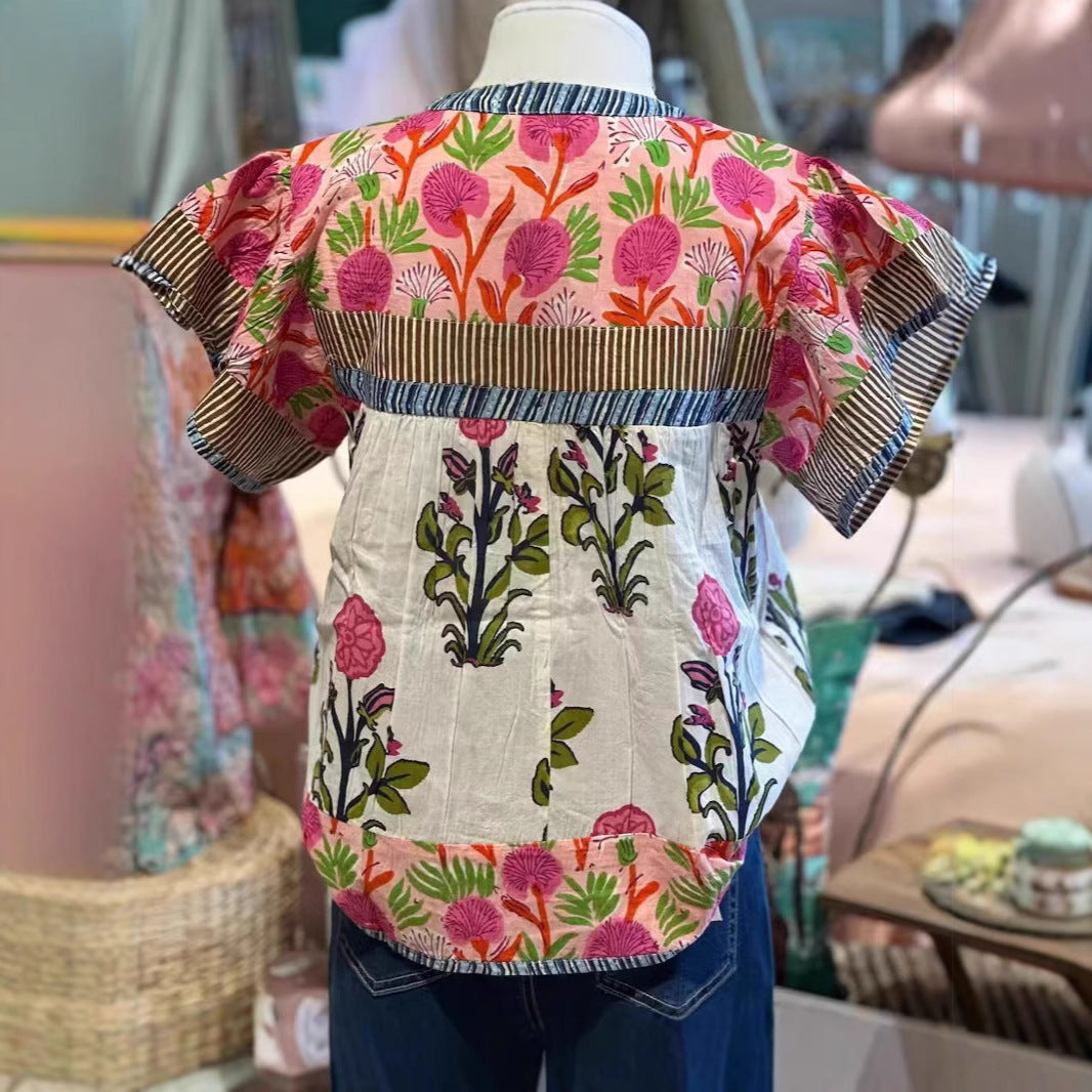 Women’s vintage floral top back view with striped yoke, mixed print, and short sleeves