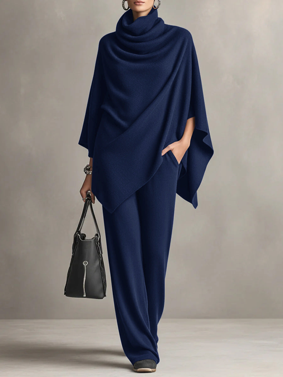 Navy two-piece set with draped cowl-neck cape top and wide-leg trousers