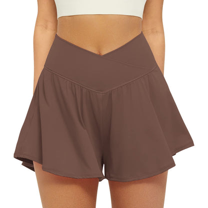 High waist active skort in brown, flowy pleated skirt with inner shorts