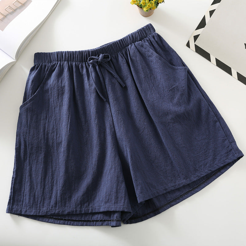 Navy relaxed-fit shorts with elastic waistband and drawstring tie
