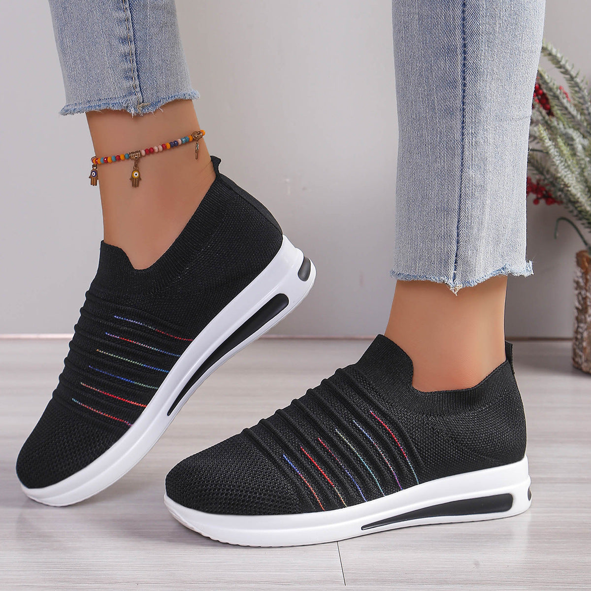 OLIVIA comfortable sneakers, black knit slip-on with stripe accents and sculpted white sole