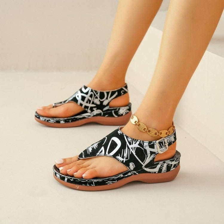 Black-and-white graphic orthopedic comfort sandals with open toe and gold chain ankle strap