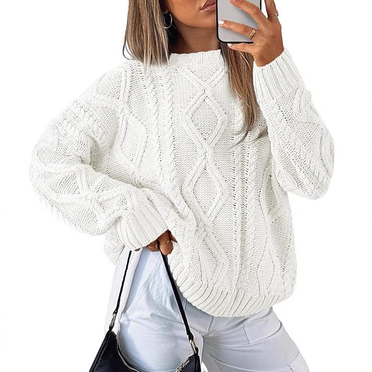 Light cream oversized cable-knit sweater with diamond cable pattern
