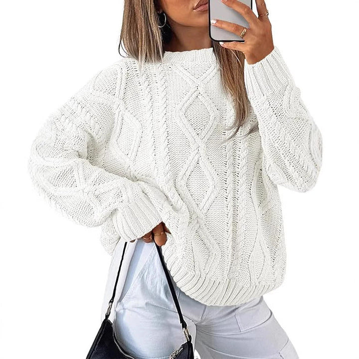 Light cream oversized cable-knit sweater with diamond cable pattern