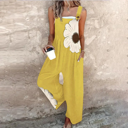 Yellow sleeveless overalls with white daisy print and wide-leg loose fit.