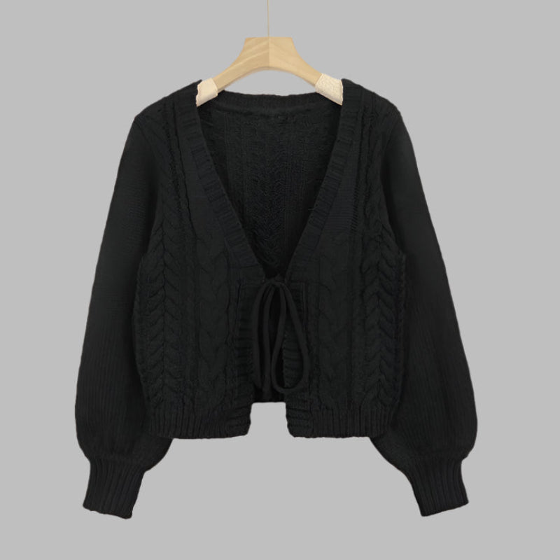 Black cable-knit tie-front chunky cardigan with V-neck and long sleeves