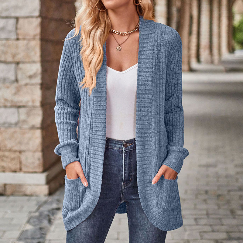 Blue lightweight open-front cardigan with long sleeves, patch pockets, ribbed knit