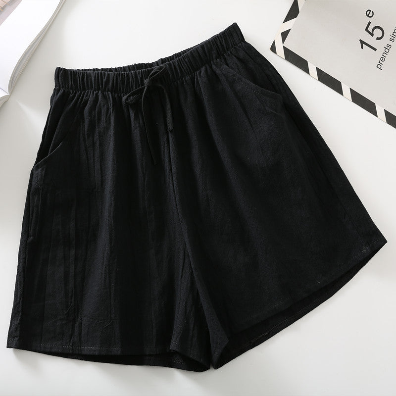 Black relaxed-fit shorts with elastic waistband and drawstring tie