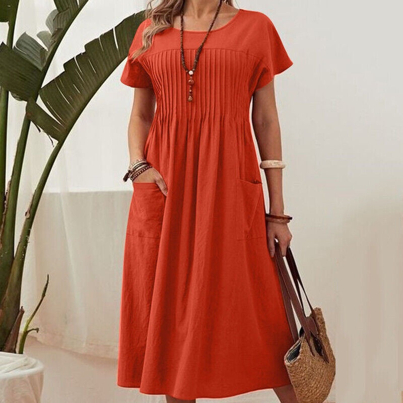 Orange midi dress with short sleeves, pleated yoke and gathered skirt