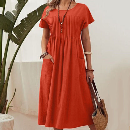 Orange midi dress with short sleeves, pleated yoke and gathered skirt
