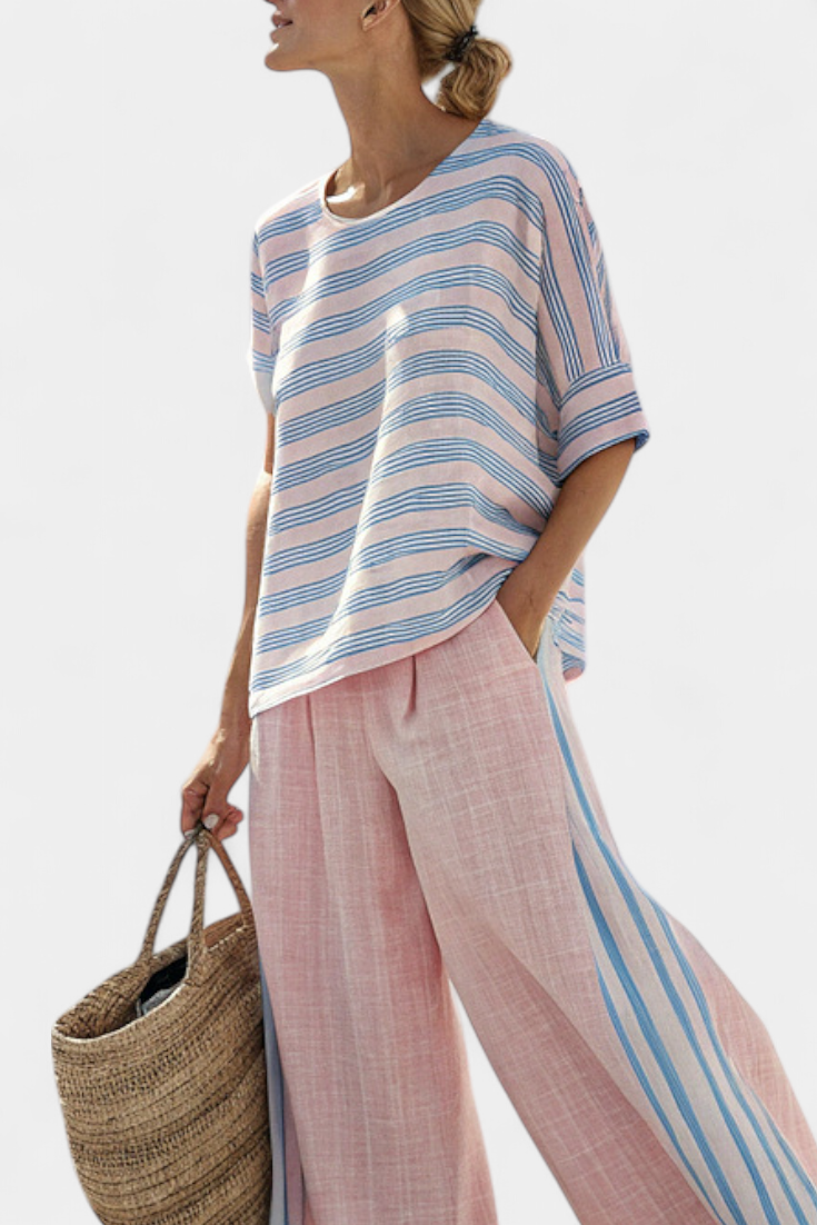 Light pink wide-leg trousers with blue side stripe seam and flowing fit