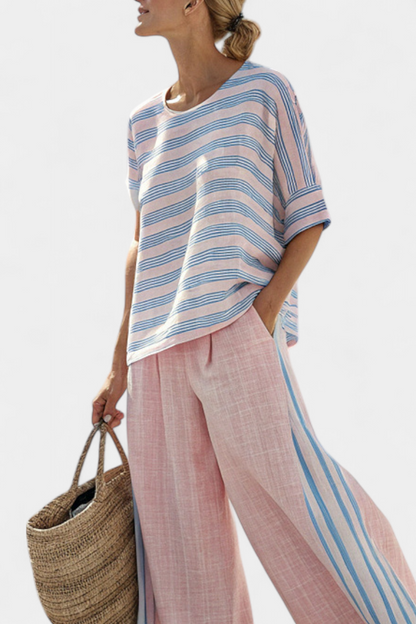 Light pink wide-leg trousers with blue side stripe seam and flowing fit