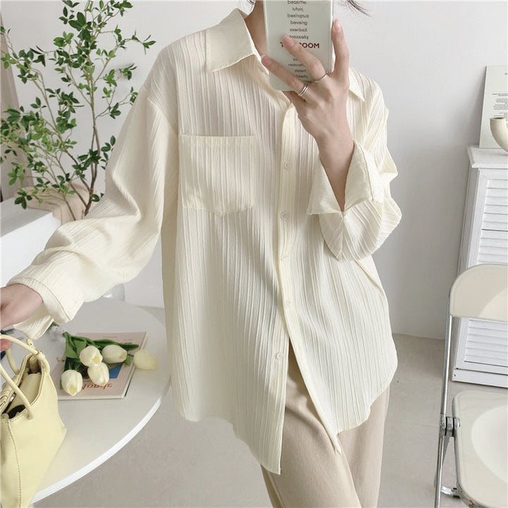 White button-up blouse with point collar, long sleeves, patch pocket details