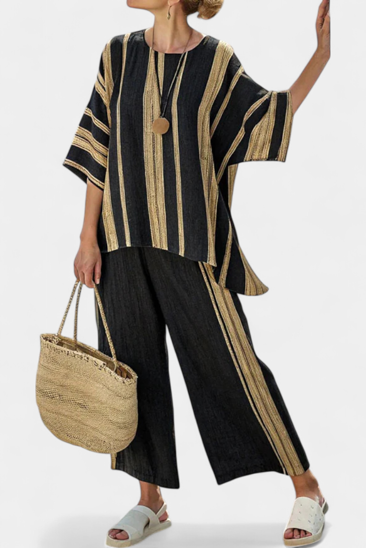 Striped black and gold relaxed top with wide sleeves, styled with black linen trousers