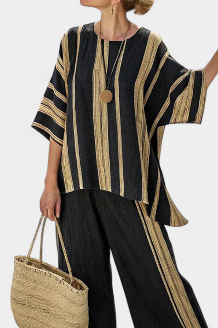 Black and gold striped oversized top with wooden button, paired with black linen trousers