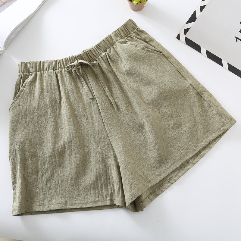 Green relaxed-fit shorts with elastic waistband and drawstring tie