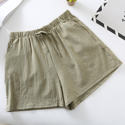 Green relaxed-fit shorts with elastic waistband and drawstring tie