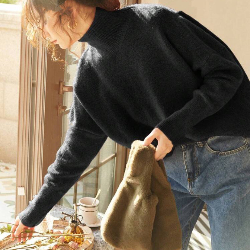 Black turtle-neck long-sleeve sweater with ribbed collar and sleeve cuffs