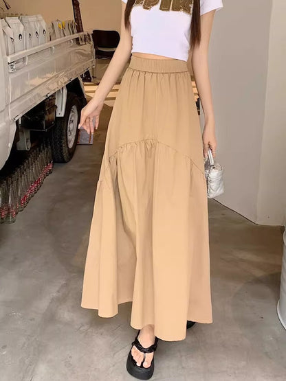 Light tan long maxi skirt with elastic waist and tiered ruffle panels