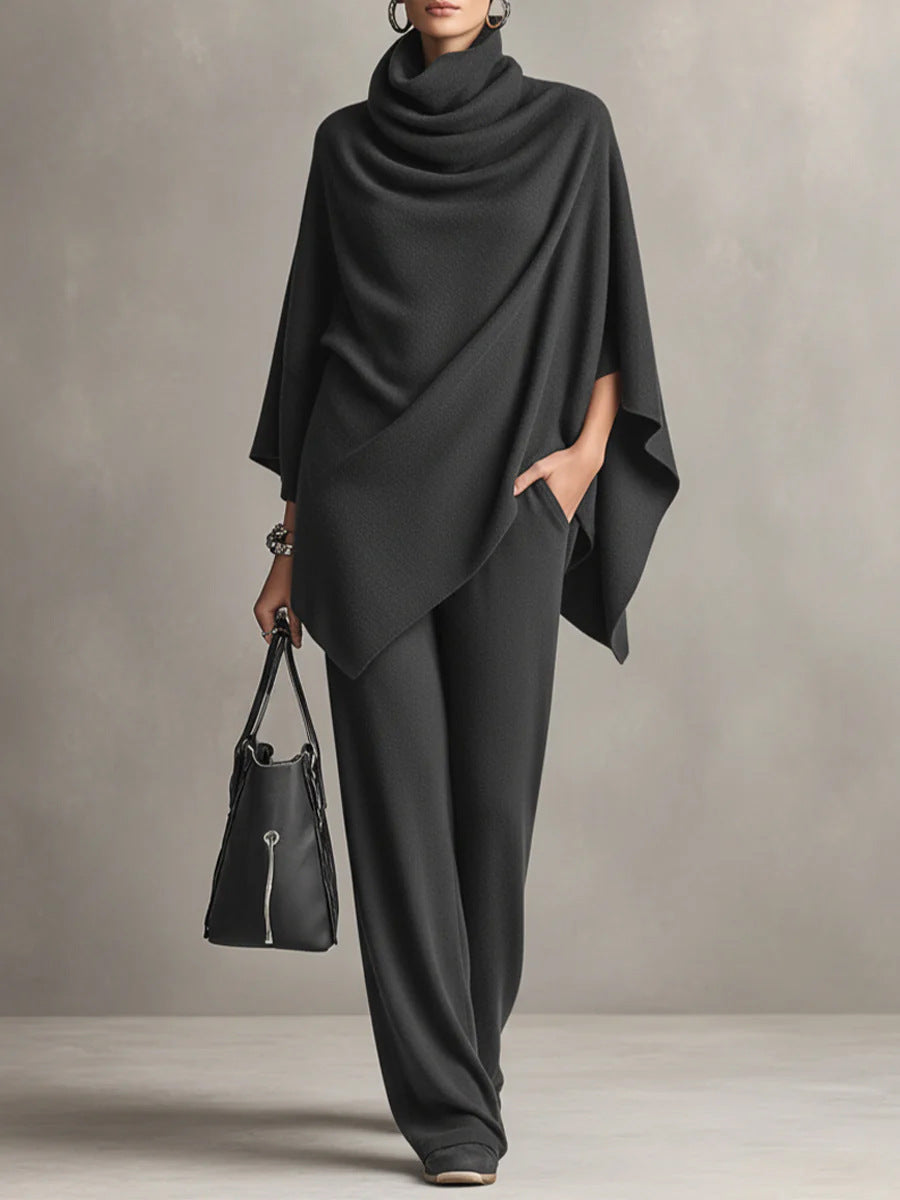 Black two-piece set with draped cowl-neck cape top and wide-leg trousers