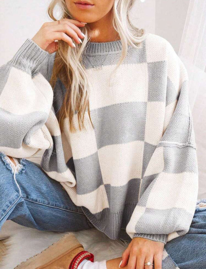 PILDA™ sweater in gray-and-white check, crew neck, loose long sleeves.