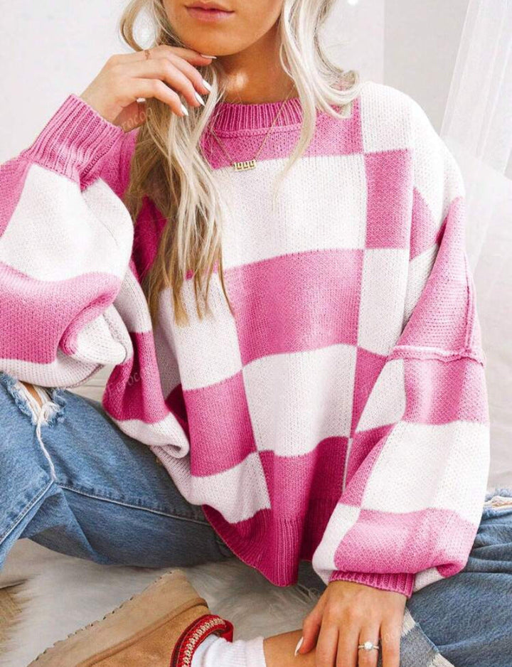 PILDA™ sweater in pink-and-white check, crew neck, loose long sleeves.