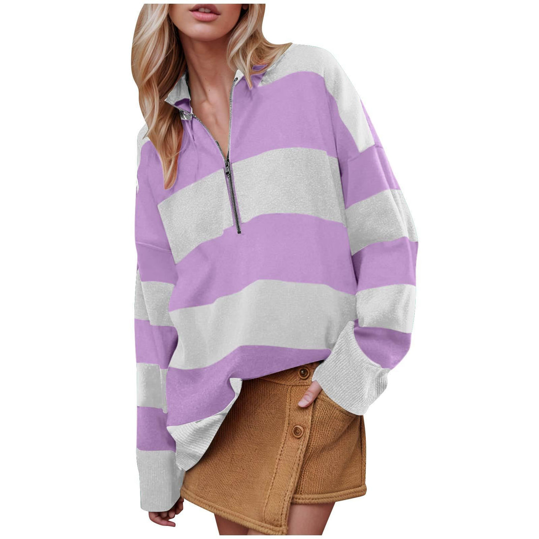 Long-sleeve pullover sweater with half-zip, purple and light gray striped design.