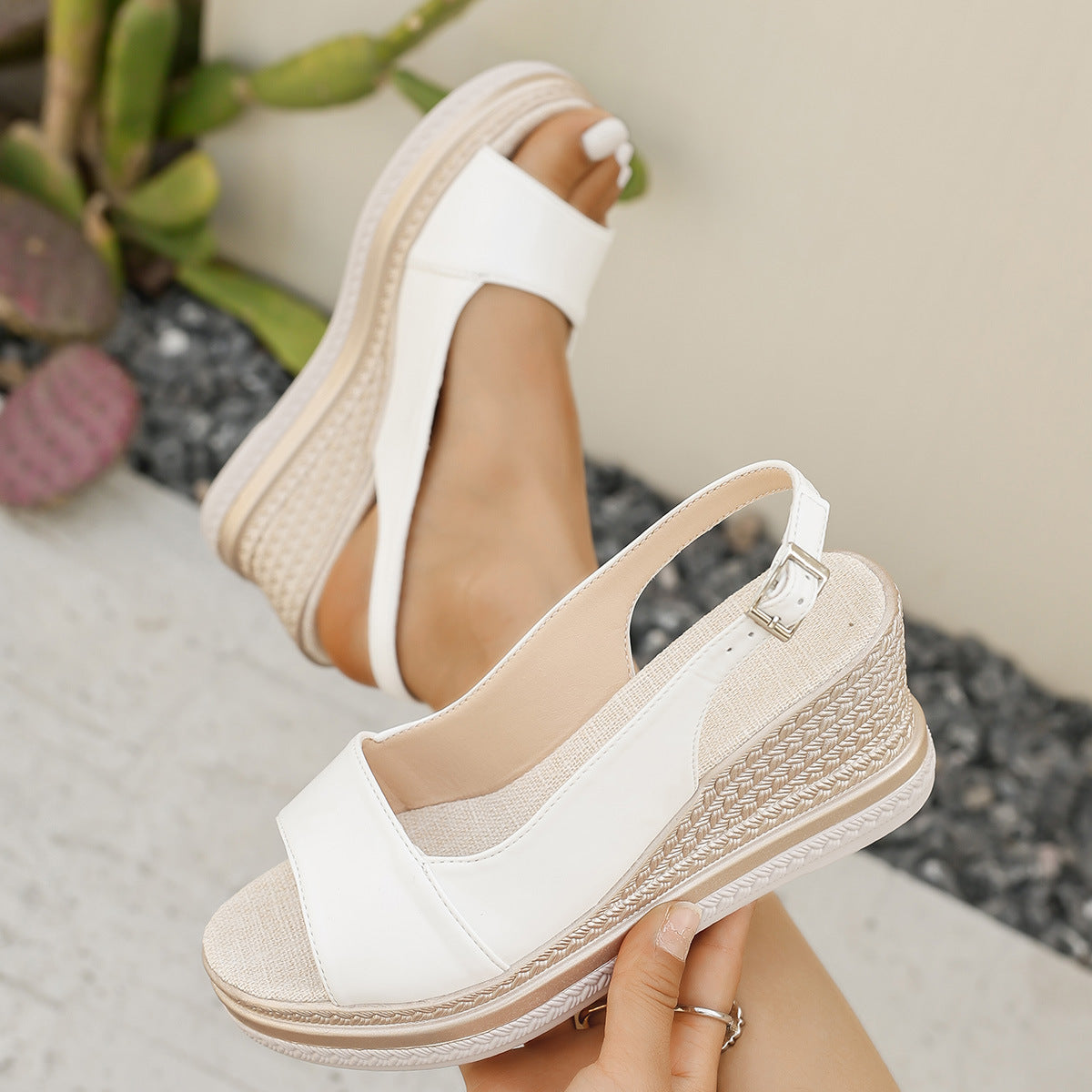 White orthopaedic wedge sandal with buckled strap and textured platform sole