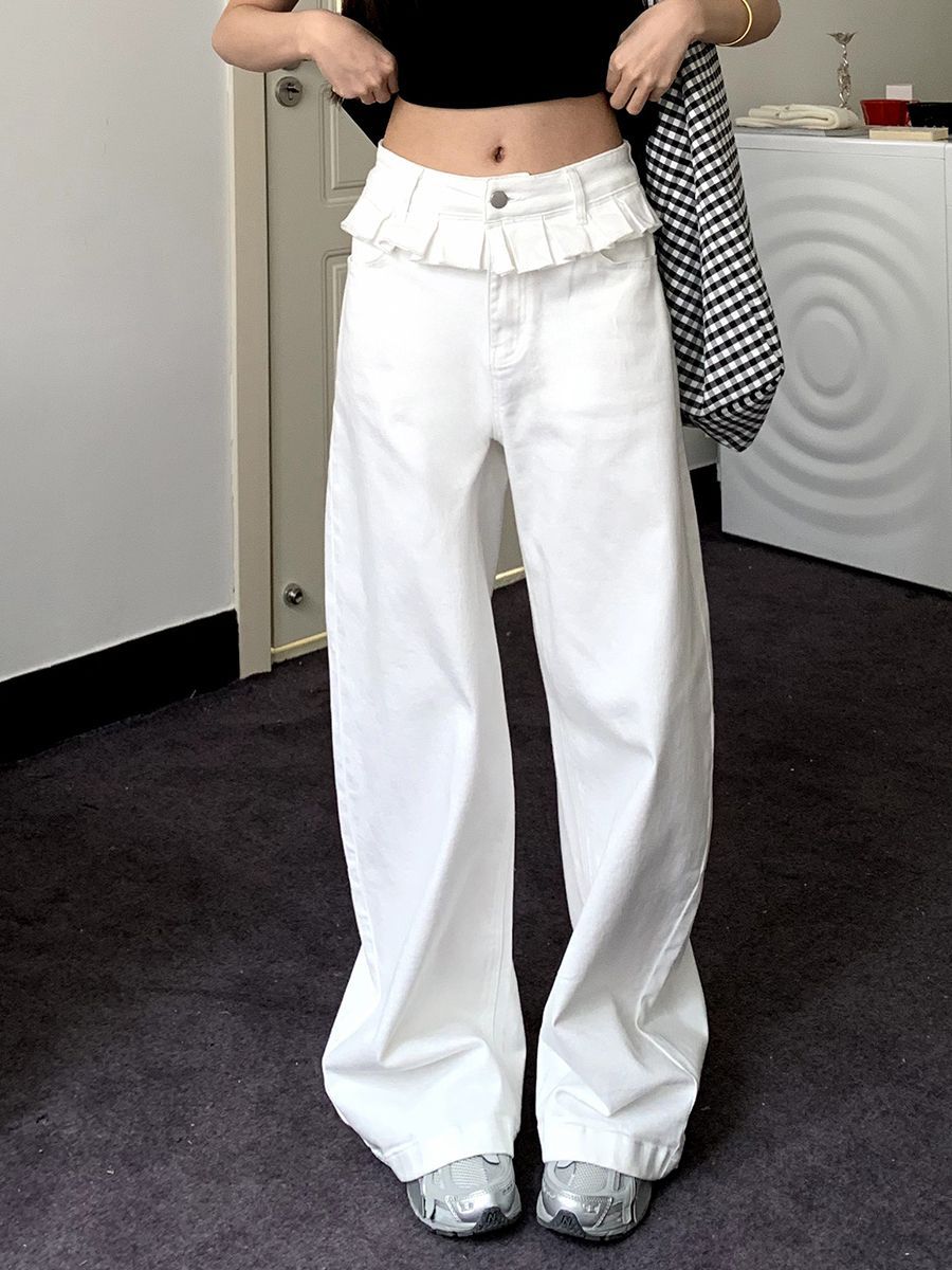 White wide-leg jeans with lace-trimmed ruffled waistband and button-front closure