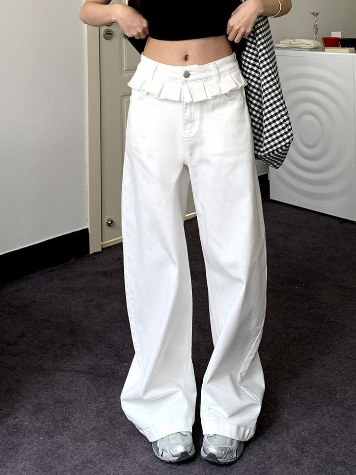 White wide-leg jeans with lace-trimmed ruffled waistband and button-front closure