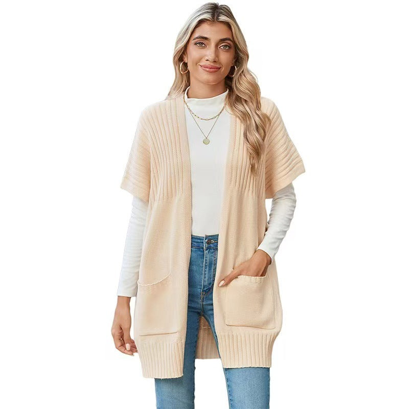 Lightweight open-front knit cardigan in cream with patch pockets and ribbed trim