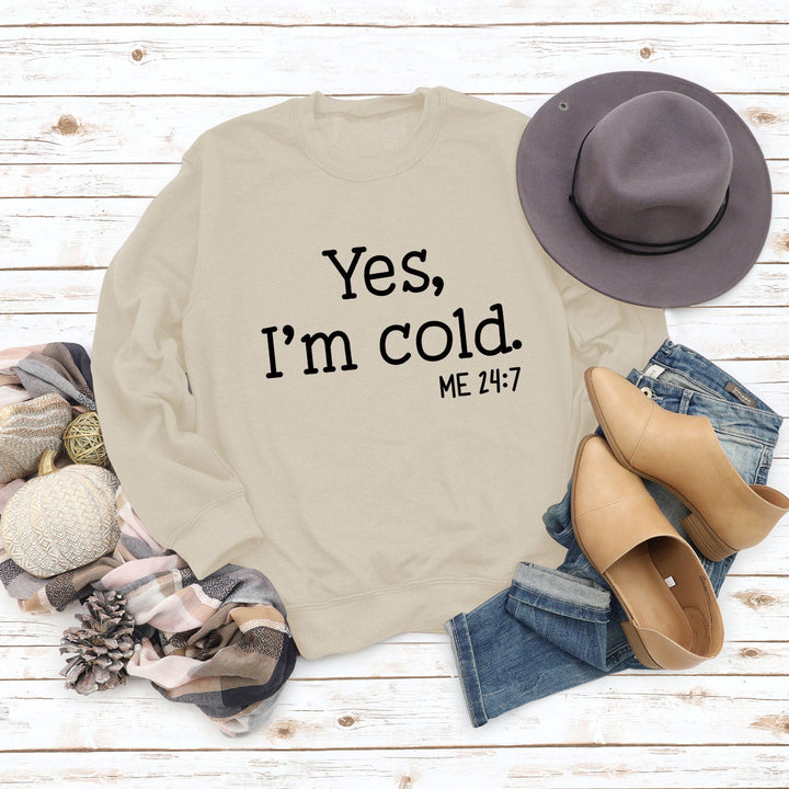 Cream pullover sweatshirt with 'Yes, I'm cold.' ME 24:7 slogan print