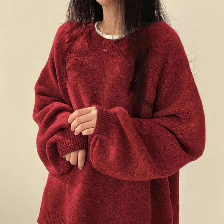 Red oversized knit sweater with crew neck, long sleeves, ribbed cuffs and hem.