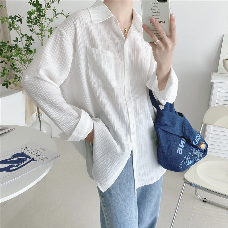 White button-up blouse with point collar, long sleeves, chest patch pocket