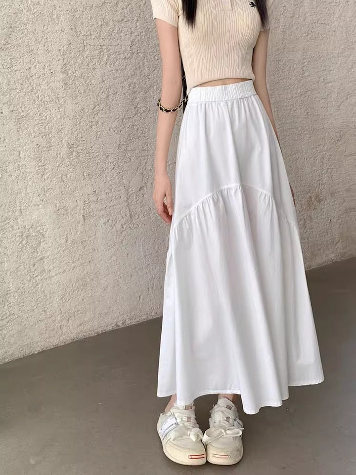 White long skirt with elastic waistband and tiered, gathered hem panels