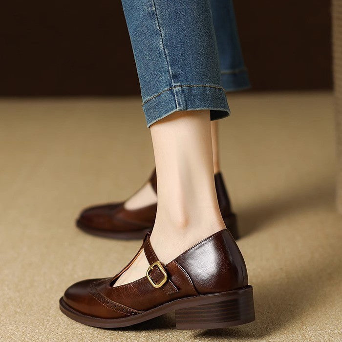 Dark brown Mary Jane shoes with gold-tone buckle strap and chunky low heel