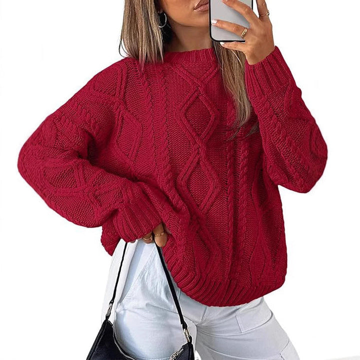 Red oversized cable-knit sweater with long sleeves and crew neck