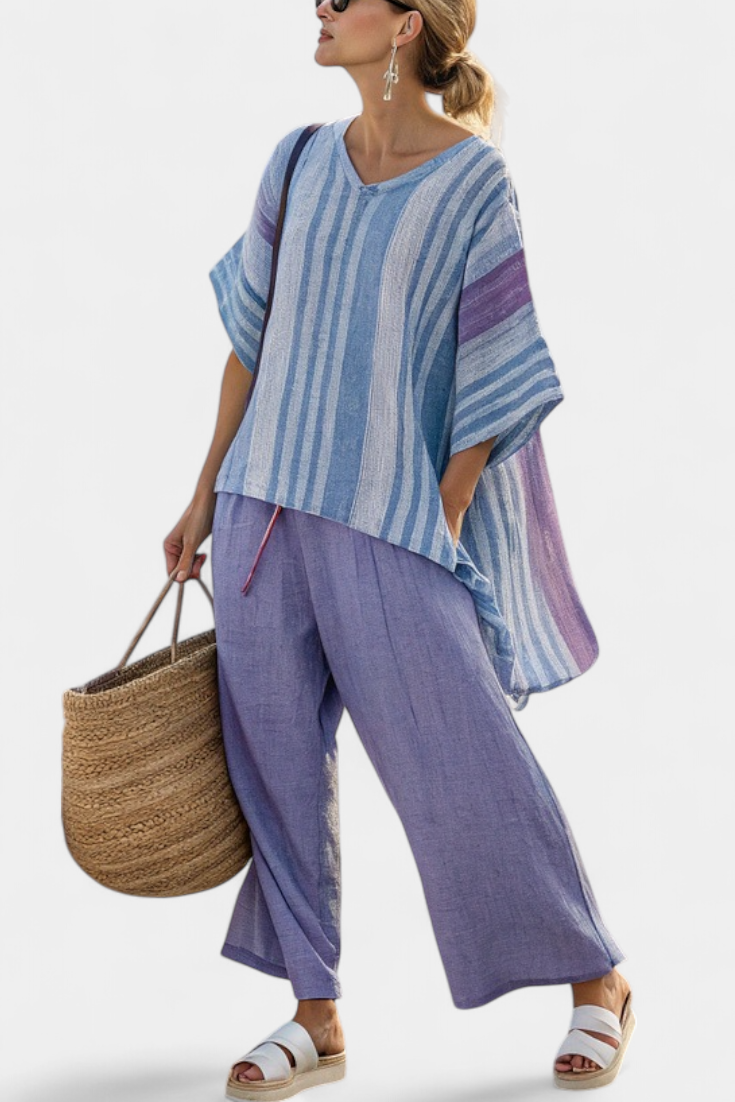Striped blue V-neck top with flowing sleeves paired with lavender wide-leg trousers