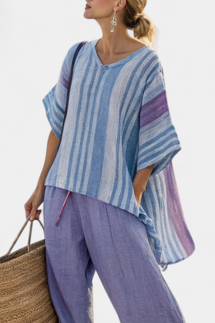 Striped blue top with V-neck and lavender wide-leg linen trousers
