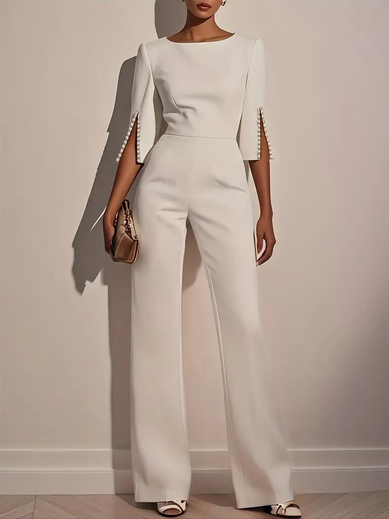 White three-piece set with fitted top and wide-leg pants, embellished bell sleeves