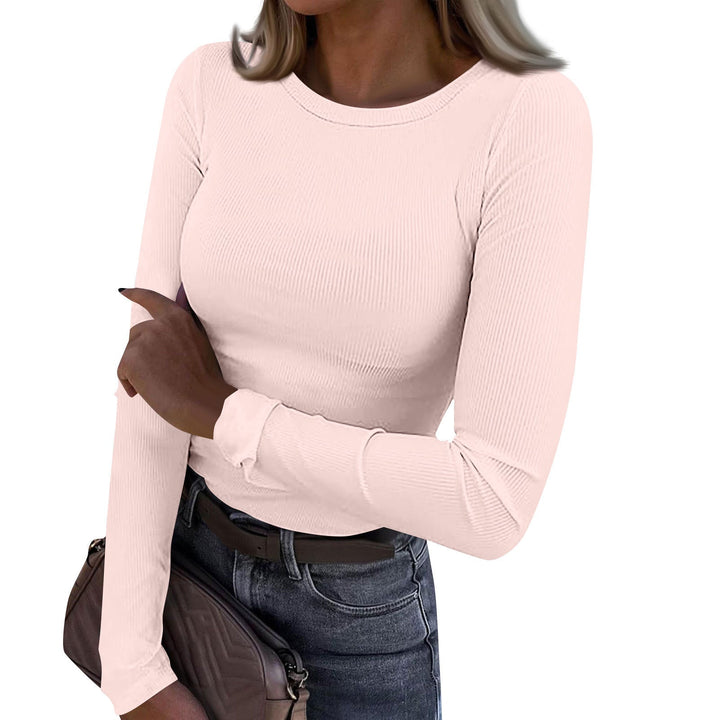Casual crewneck ribbed long-sleeve top in light pink, fitted fit, stretchy knit texture.
