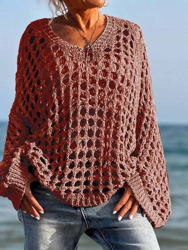 Comfy long-sleeve knit top in caramel orange with openwork pattern and fringe trim