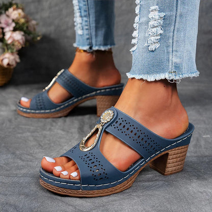 Blue orthopedic sandals with perforated upper and jeweled side strap detail