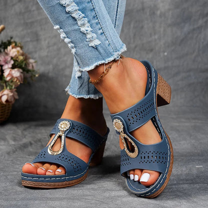 Blue orthopedic sandals with perforated upper and jeweled side strap charm