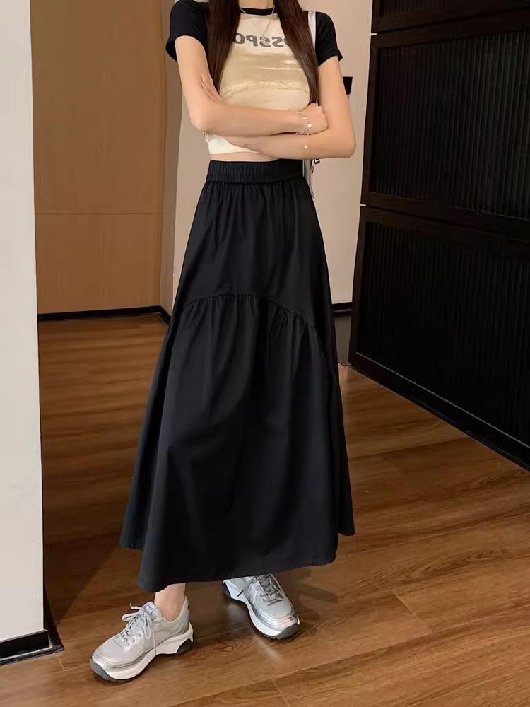 Black long tiered skirt with elastic waistband and gathered mid-panel